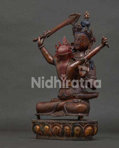 Manjushri consort holding kartika knife and skull cup in sacred union.