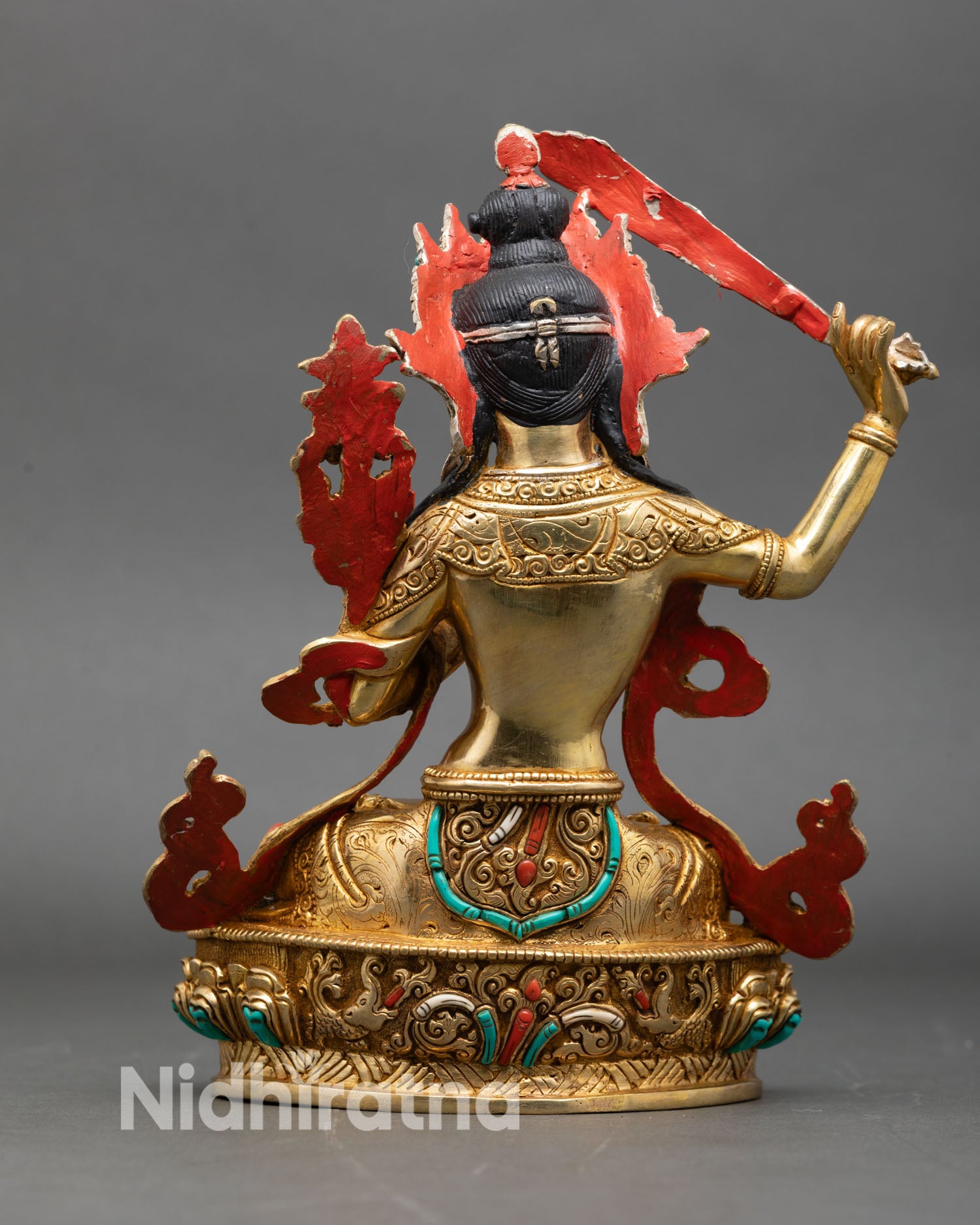 manjushri statue back view, engraved floral designs on lotus base with gold finish