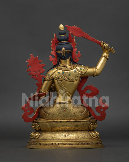 Manjushri statue back view showing detailed copper casting and traditional Newari artwork