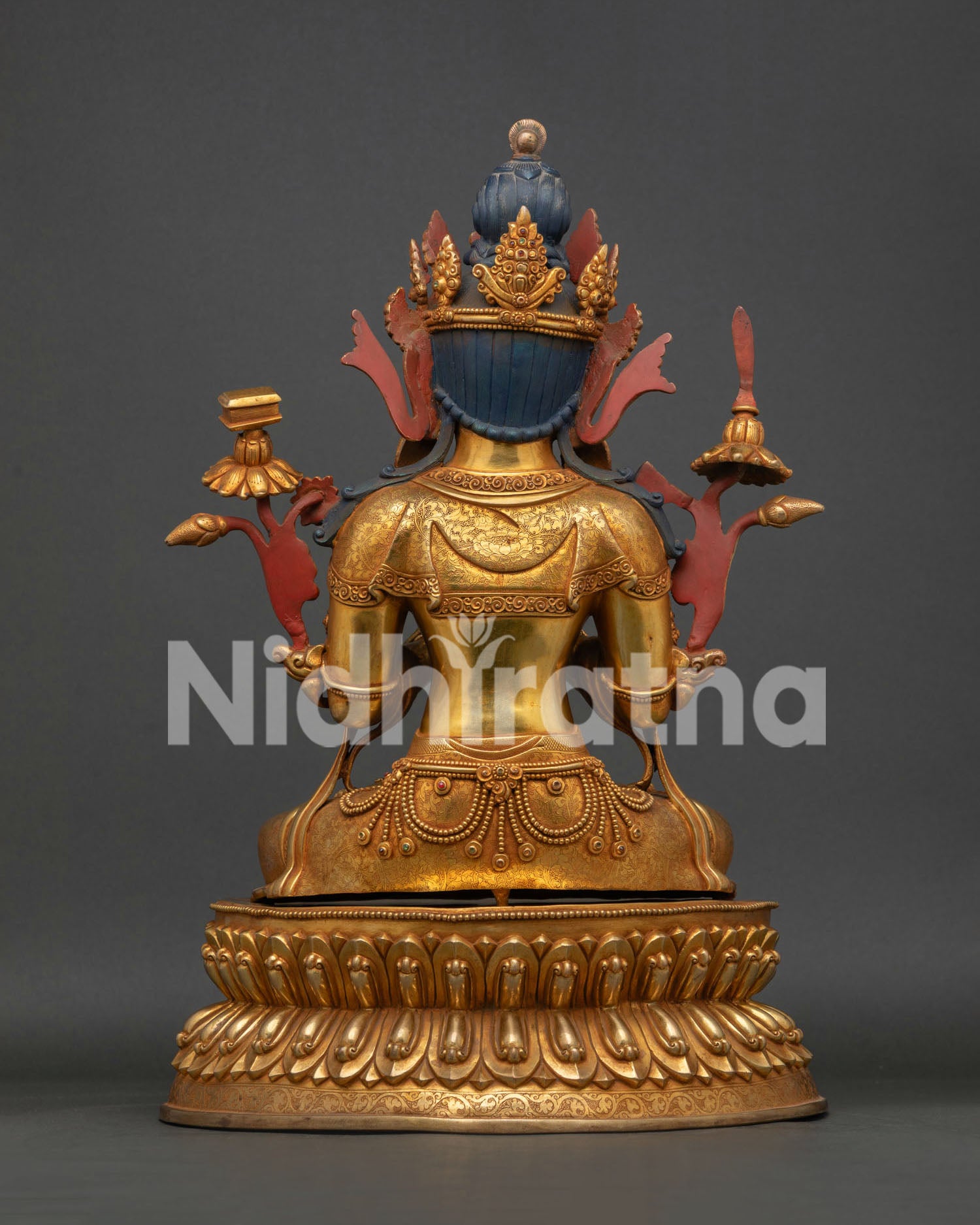 Manjushri statue back view showing handcrafted copper sculpture and gold gilded finish