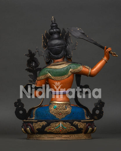 Manjushri Statue Back View with Intricate Floral Garment and Himalayan Craftsmanship.