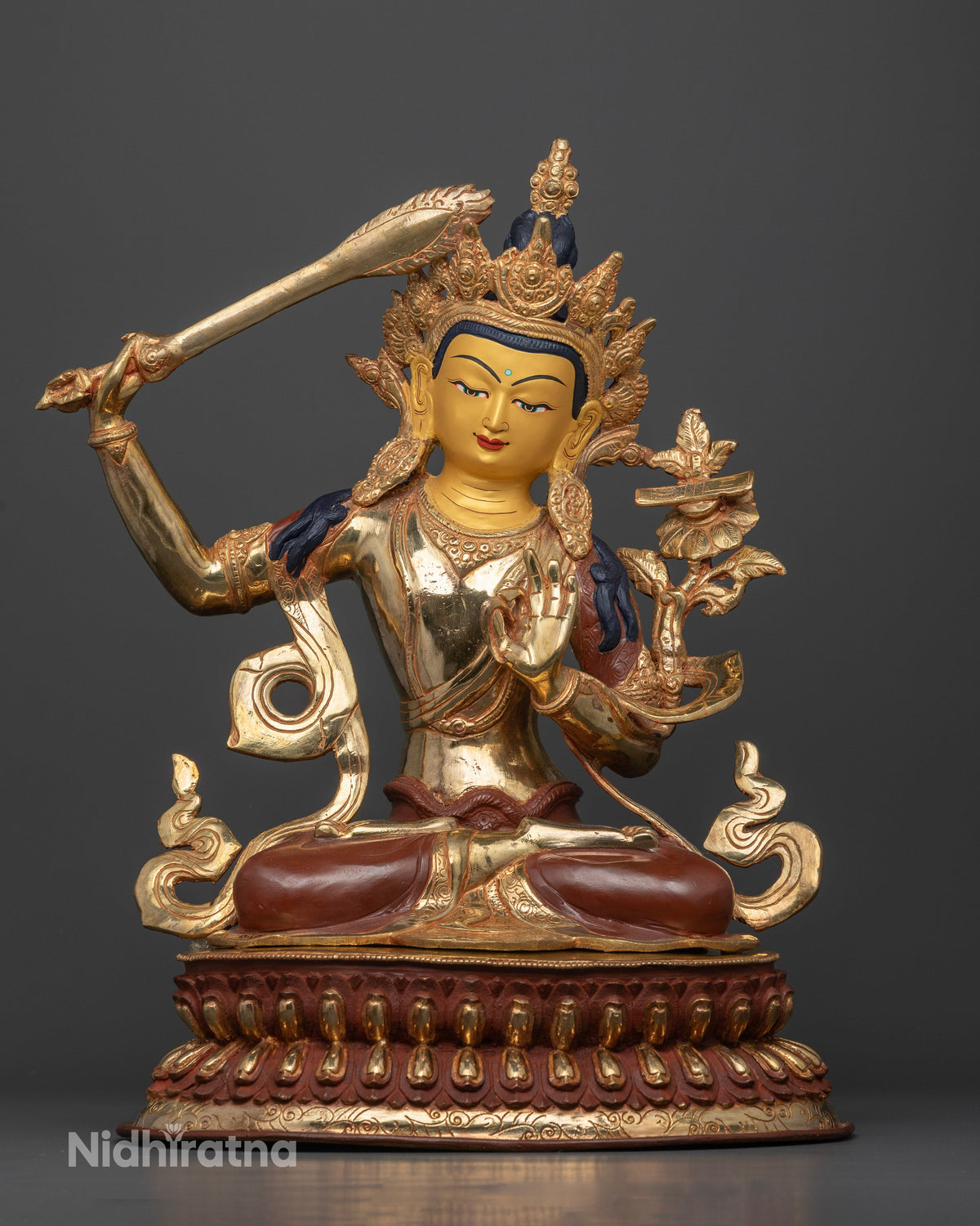 Manjushri statue Bodhisattva of wisdom chemically oxidized copper.