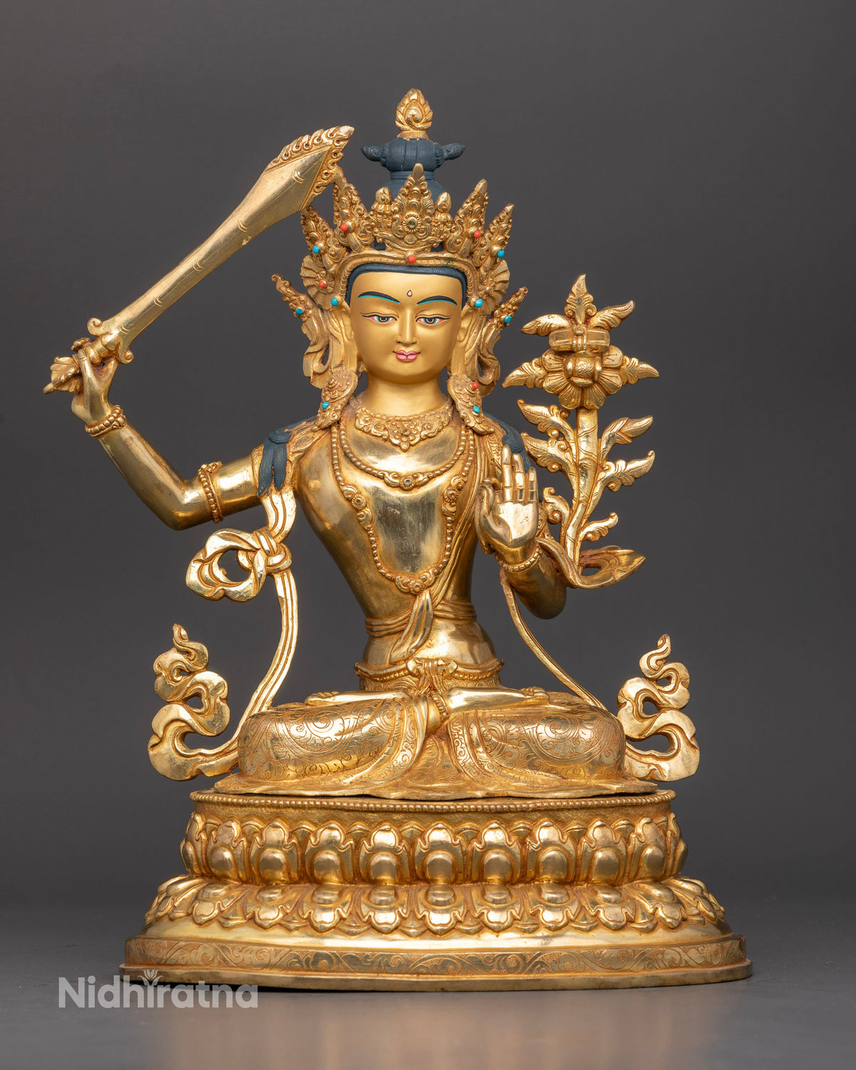 Manjushri statue Bodhisattva of Wisdom gold fire gilded Nepalese Buddhist statue front view.