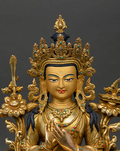 Manjushri statue close up enlightened wisdom face gold details Himalayan copper craftsmanship Nepal