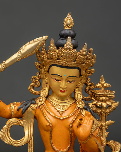Manjushri statue copper gold gilded 24K gold painted face.