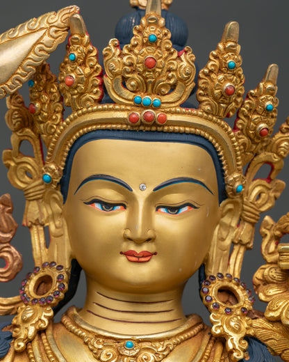 Manjushri Statue face close up five jewel crown gold gilded details.