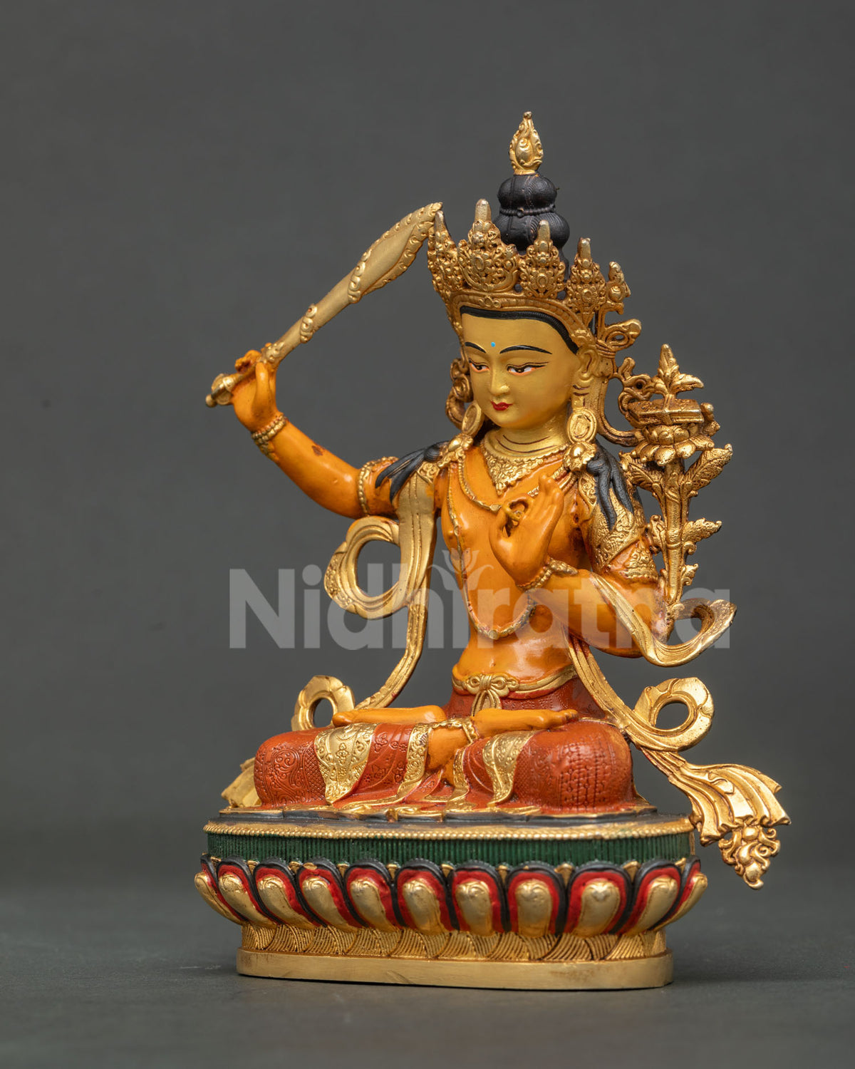 Manjushri statue floral motif robes Newari Nepalese craft.