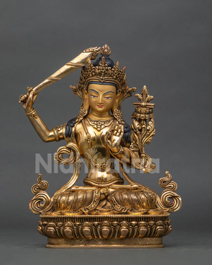Manjushri statue from patan nepal with copper body and gold fire gilded finish.