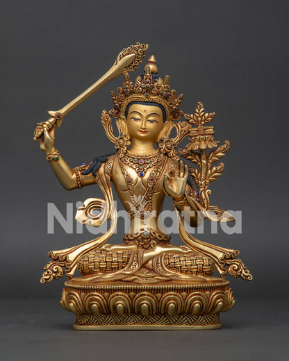 Manjushri statue front view, handcrafted Nepalese gold gilded copper Buddhist sculpture