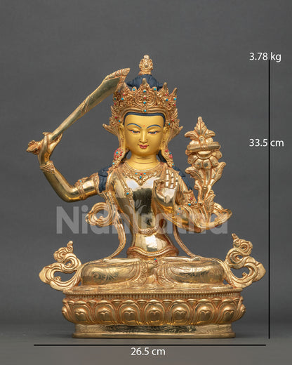 Manjushri statue gold fire gilded copper Patan Nepal.