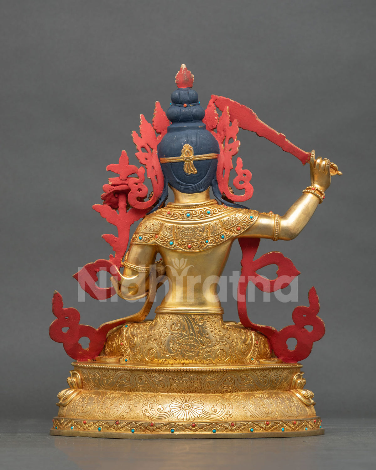 Manjushri Statue hand carved floral garment lotus pedestal.