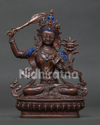Manjushri statue, handcrafted by Newari artisans in Patan, Nepal with oxidized copper finish