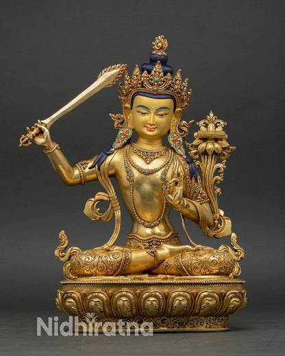 Manjushri statue handcrafted in Nepal, copper with gold fire gilding 