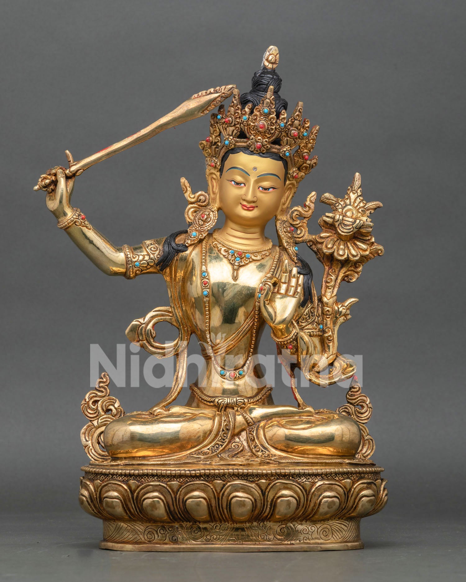 Manjushri statue handcrafted in Nepal with gold-gilded copper body and lotus throne