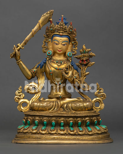 manjushri statue handcrafted in nepal with gold gilding and turquoise stone inlays
