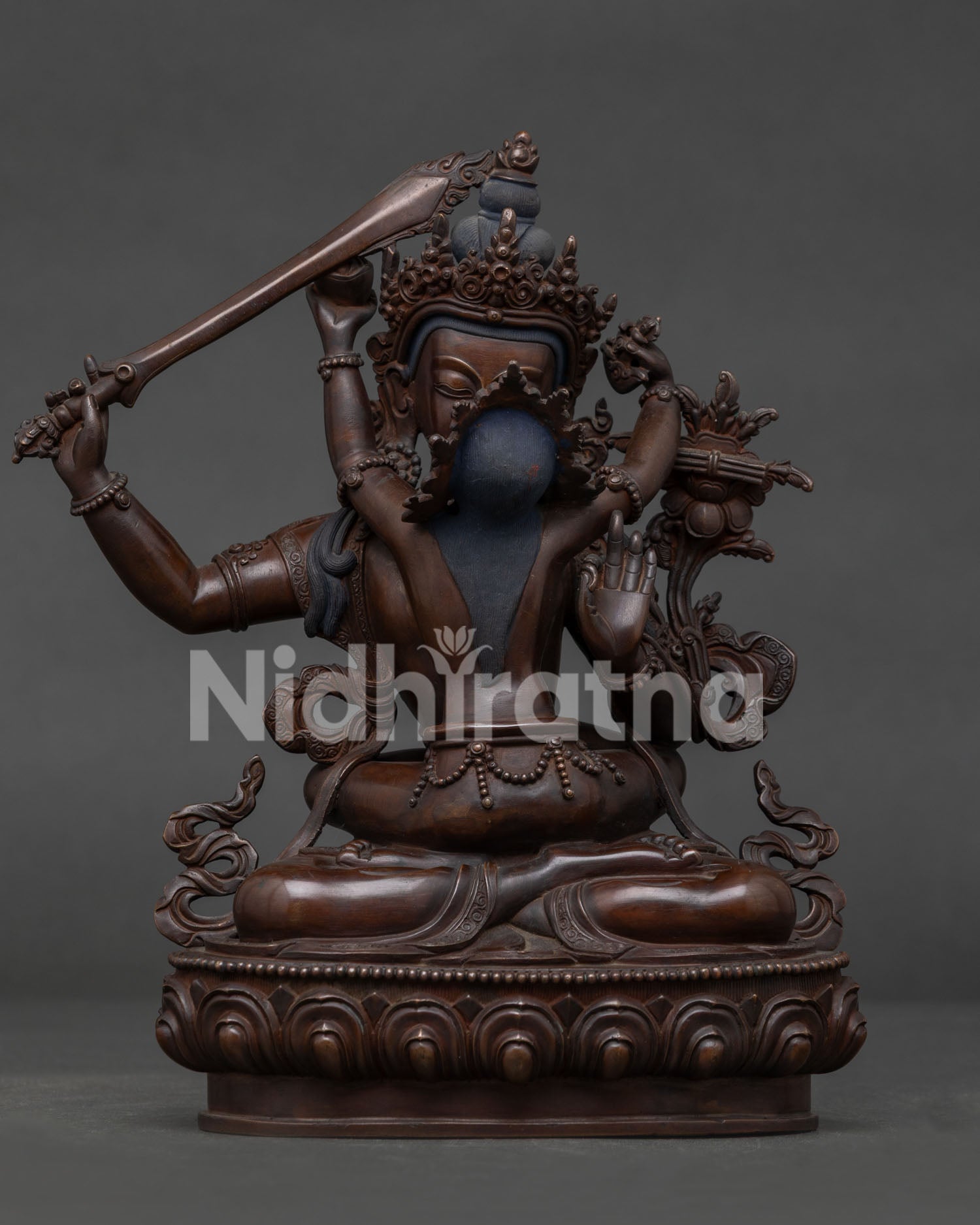 Manjushri Statue Handcrafted in Nepal with Oxidized Copper Finish.