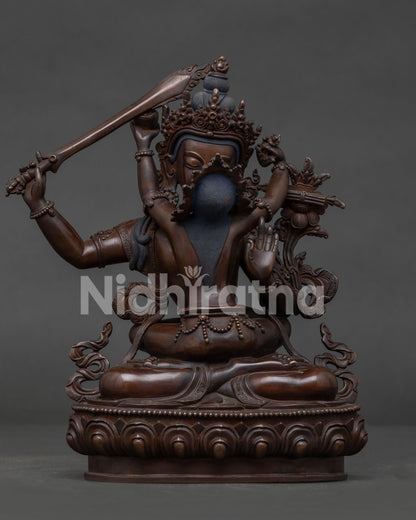 Manjushri Statue Handcrafted in Nepal with Oxidized Copper Finish.