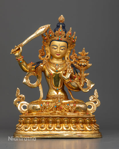 Manjushri statue handcrafted Newari artist Patan Nepal copper gold fire gilded 24K gold painted face.