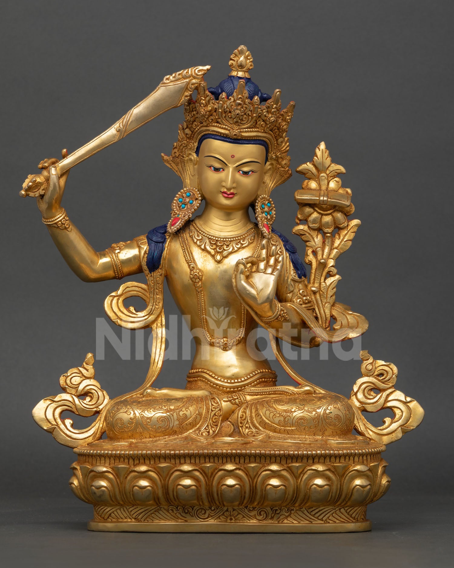 Manjushri Statue handmade by a Newari artist from Patan, Nepal, copper, gold-gilded, serene gold-painted face