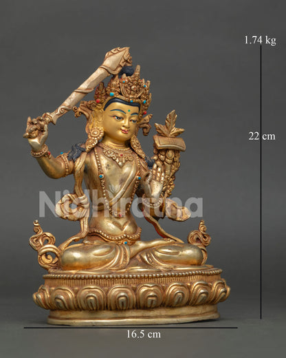 Manjushri Statue, holding the flaming sword of transcendent wisdom and the sacred Prajnaparamita Sutra.