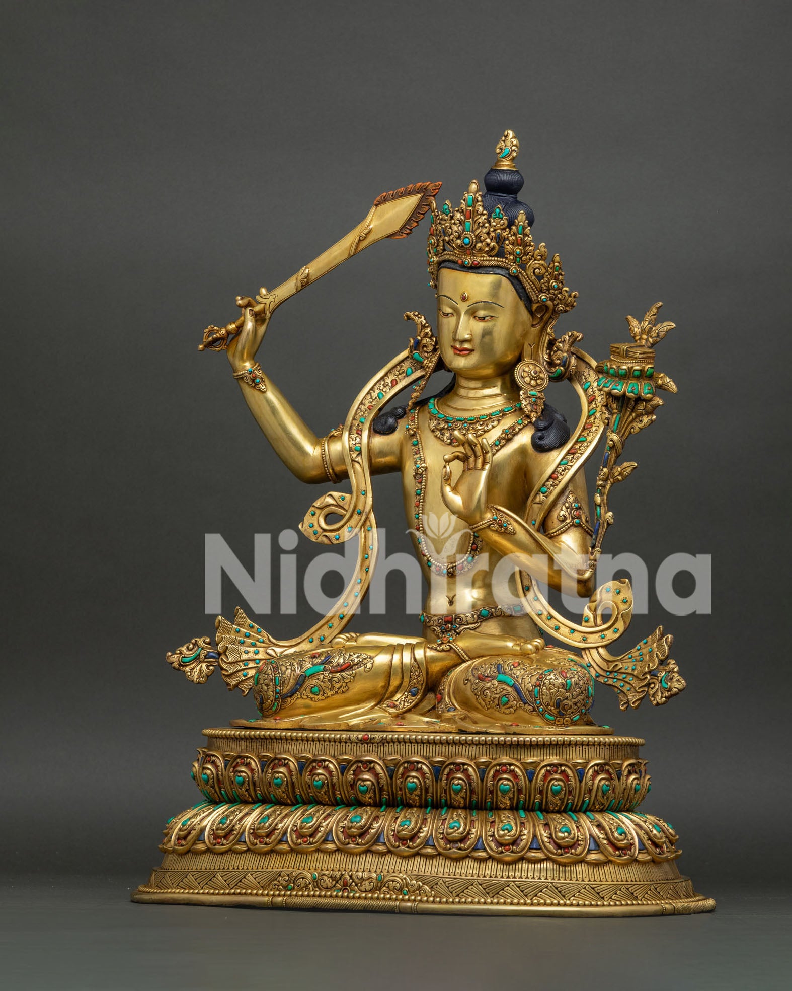 Manjushri statue left side view, utpala lotus and Prajnaparamita Sutra, gold gilded Nepal sculpture
