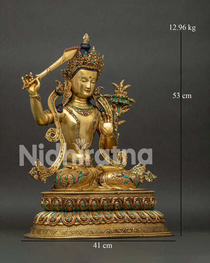 Manjushri statue right side view, flaming wisdom sword raised, gold copper sculpture from Nepal