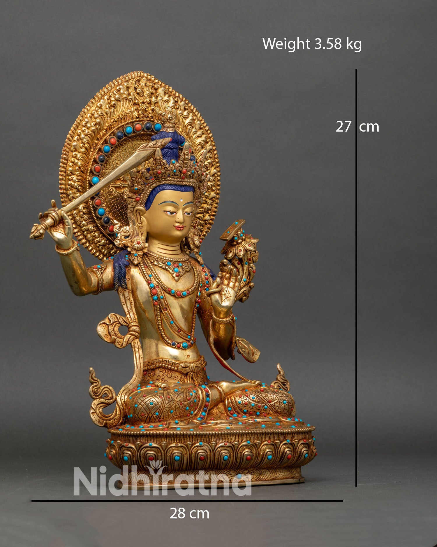 right side view of manjushri statue holding wisdom sword and utpala flower on lotus base