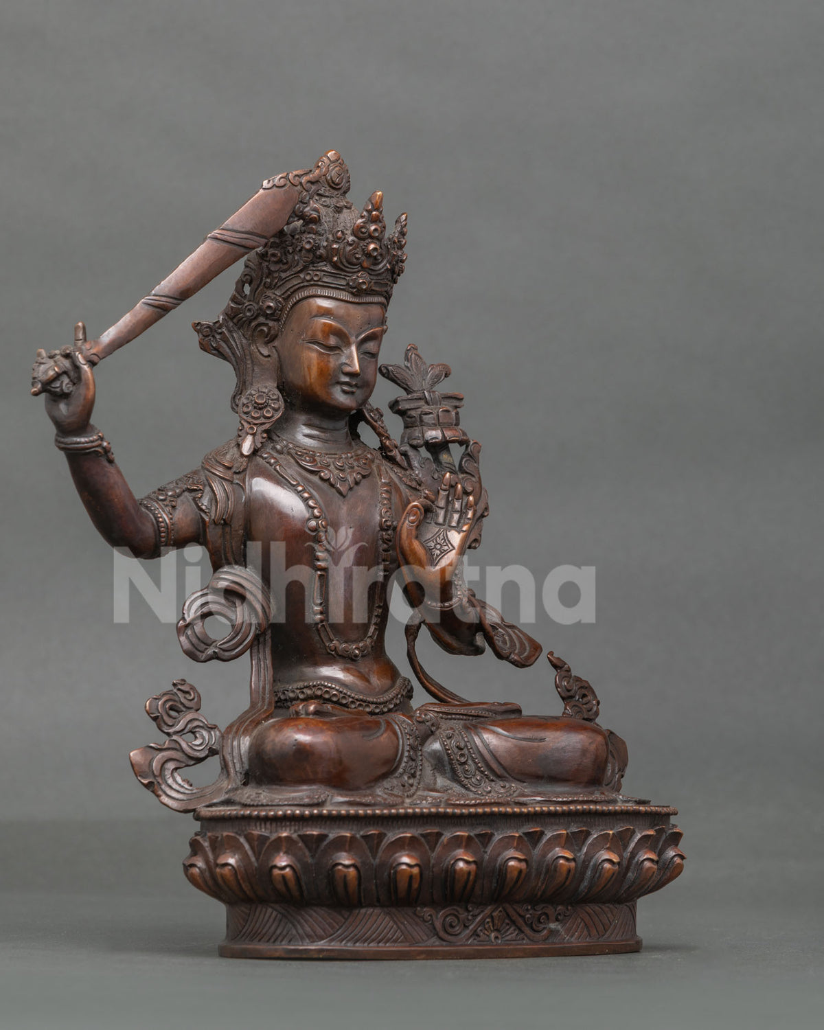 Manjushri Statue right view flaming wisdom sword lotus pedestal.