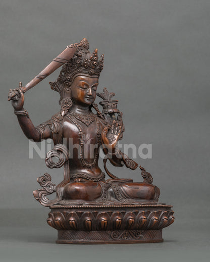 Manjushri Statue right view flaming wisdom sword lotus pedestal.
