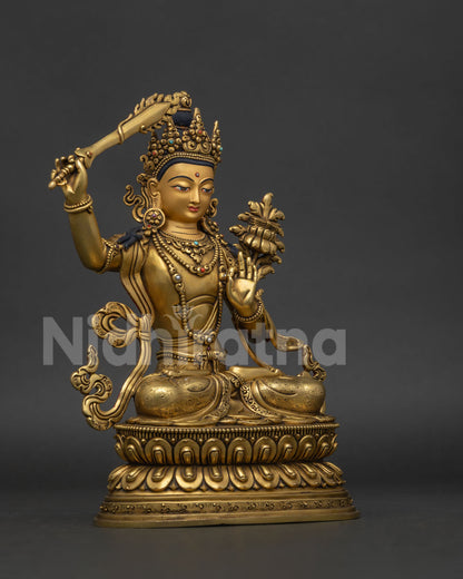 Manjushri statue right view side showing flaming wisdom sword and ornate lotus base