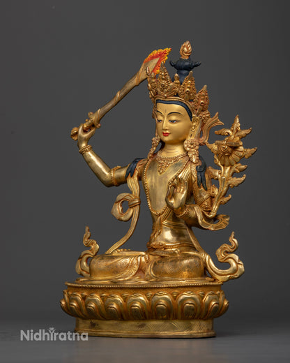 Manjushri Statue on hand carved lotus pedestal with intricate gold gilded details.