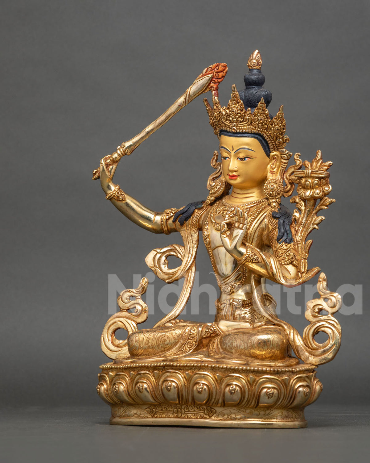 Manjushri Statue side view flaming wisdom sword five jewel crown gold finish.
