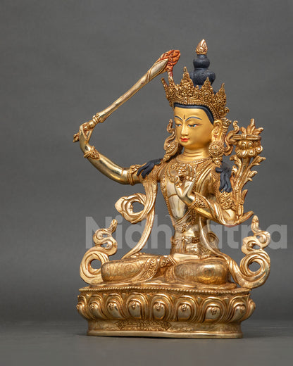Manjushri Statue side view flaming wisdom sword five jewel crown gold finish.