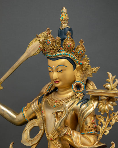 Manjushri statue upper body, sword and blossoming lotus flower detail