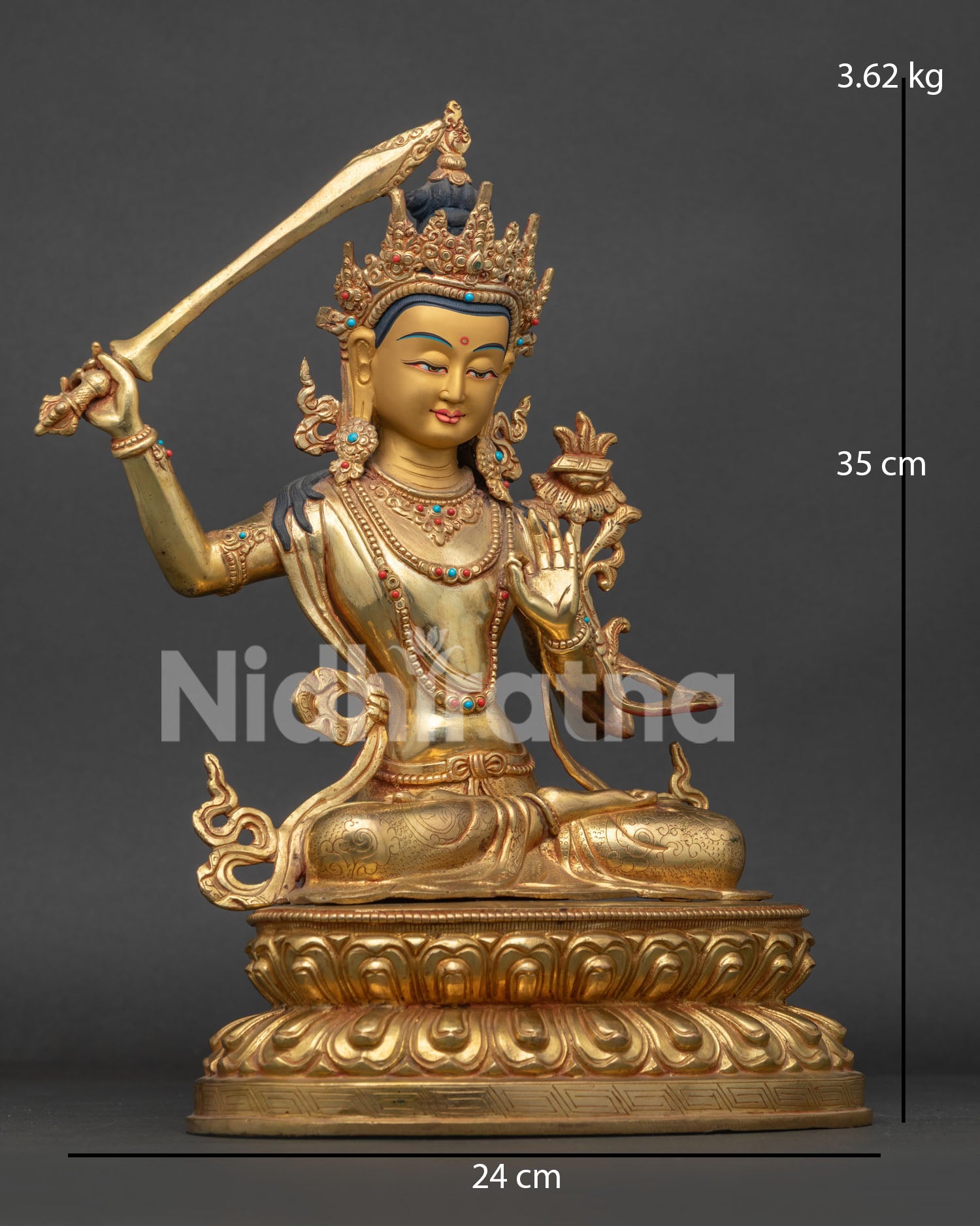Manjushri Statue with flaming sword and semi precious stones.