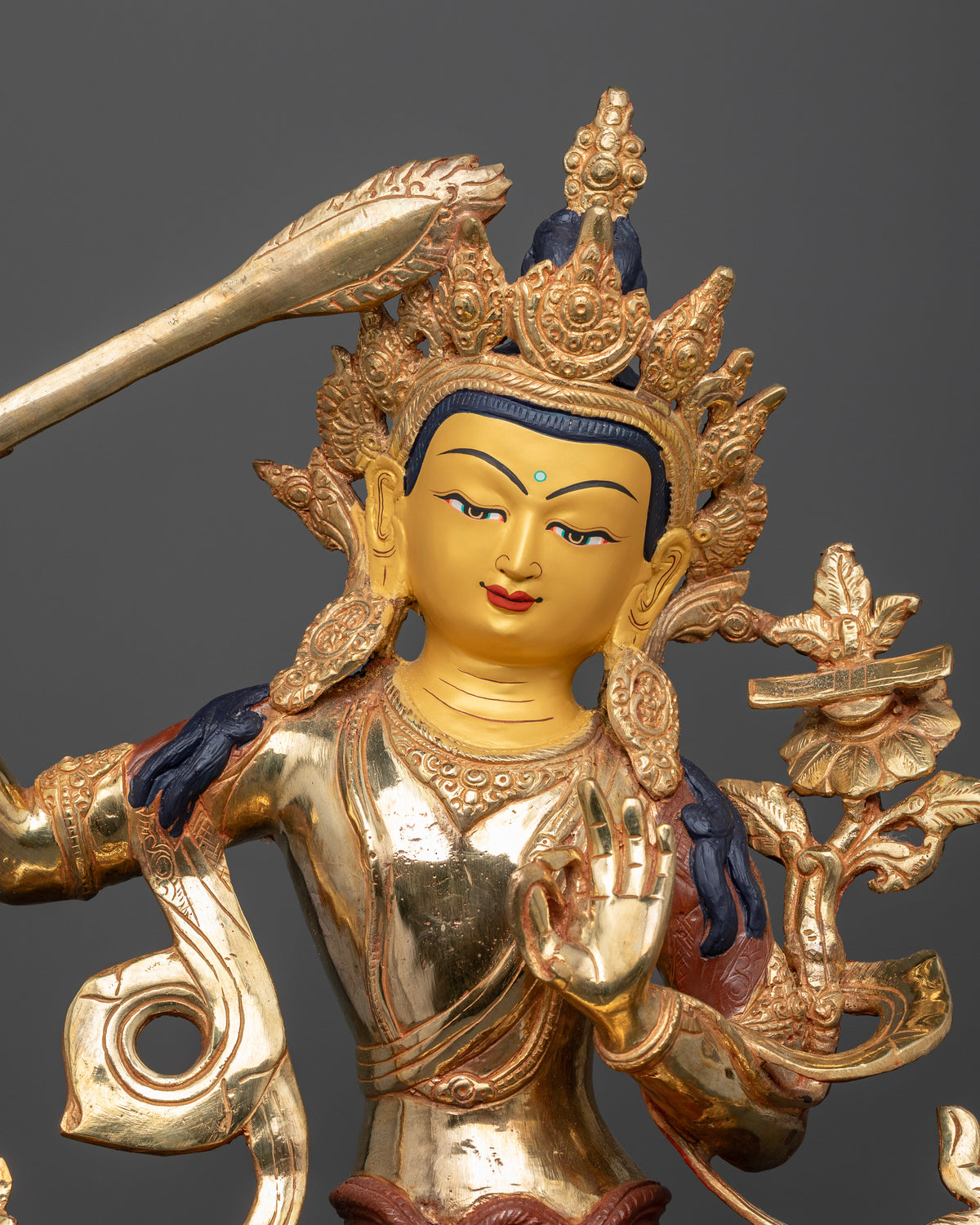 Manjushri wisdom statue silk garment layered necklaces Buddhist altar.