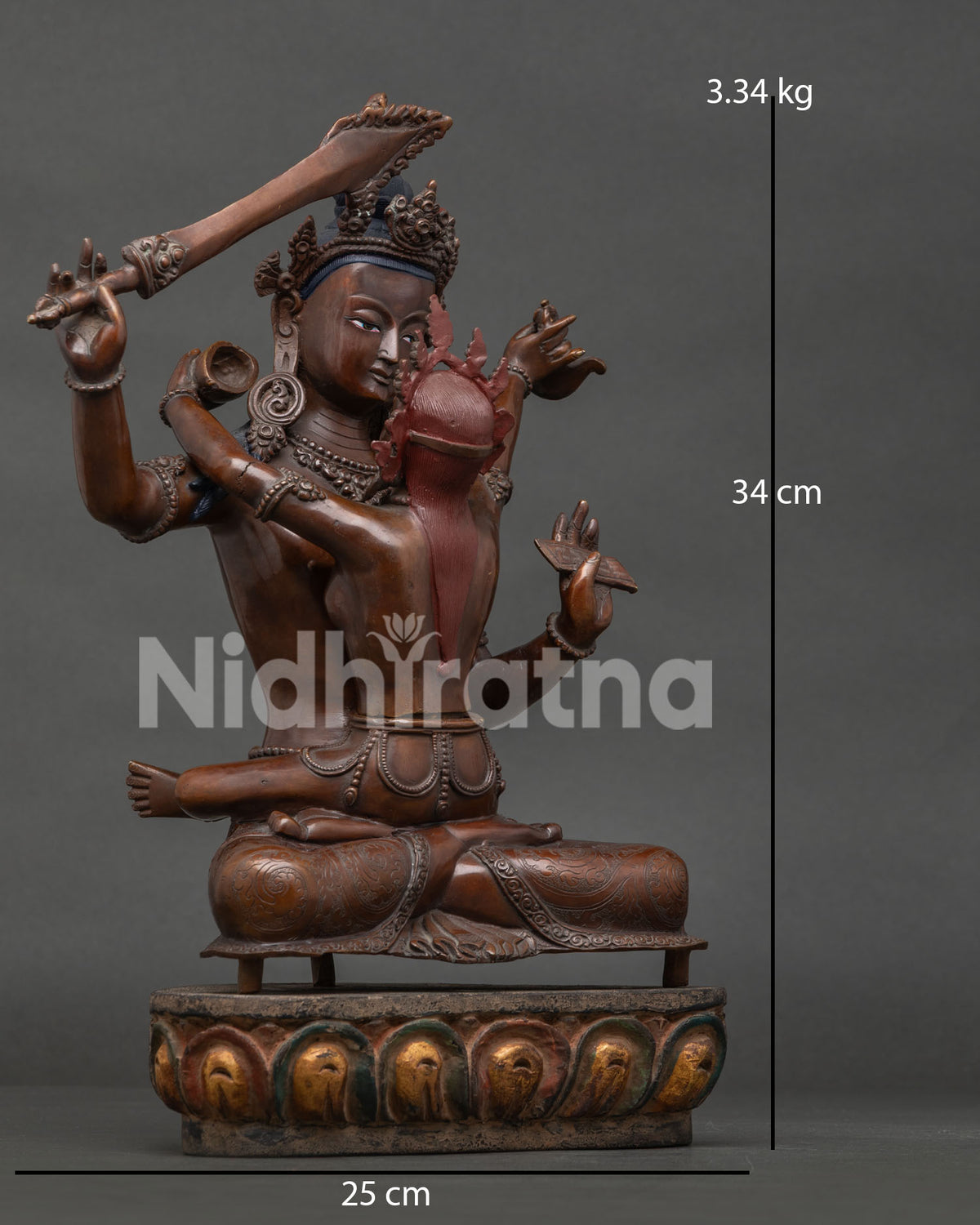 Manjushri with consort seated on lotus pedestal in Yab Yum posture.