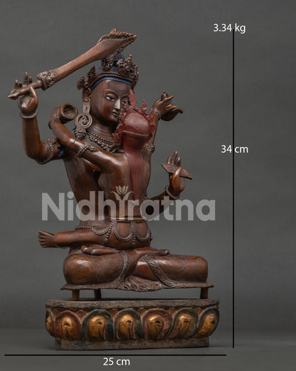 Manjushri with consort seated on lotus pedestal in Yab Yum posture.
