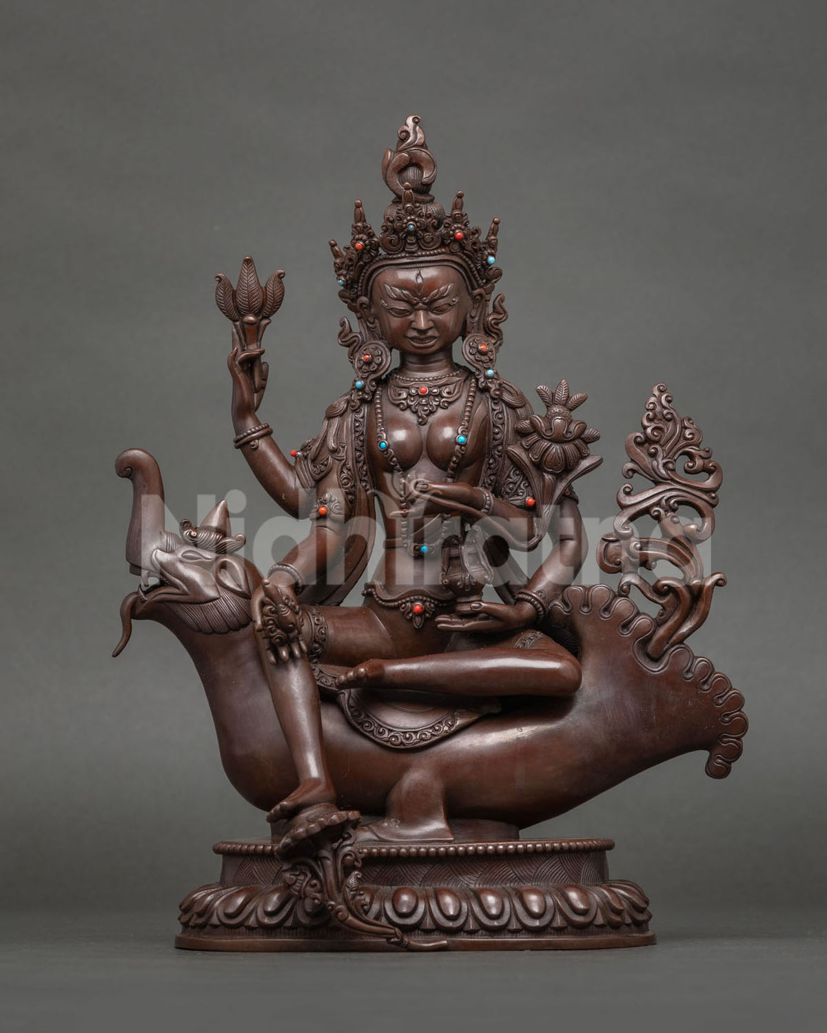 Maramardanesvari Tara statue, conqueror of Mara on a mythical mount, oxidized copper