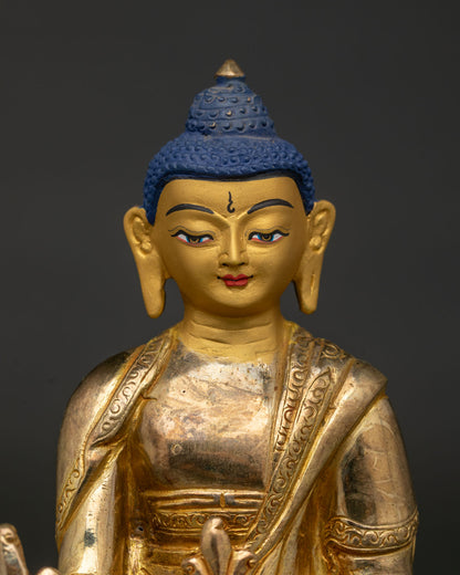 Medicine Buddha Gold Painted Face with Healing Bowl Close Up View.