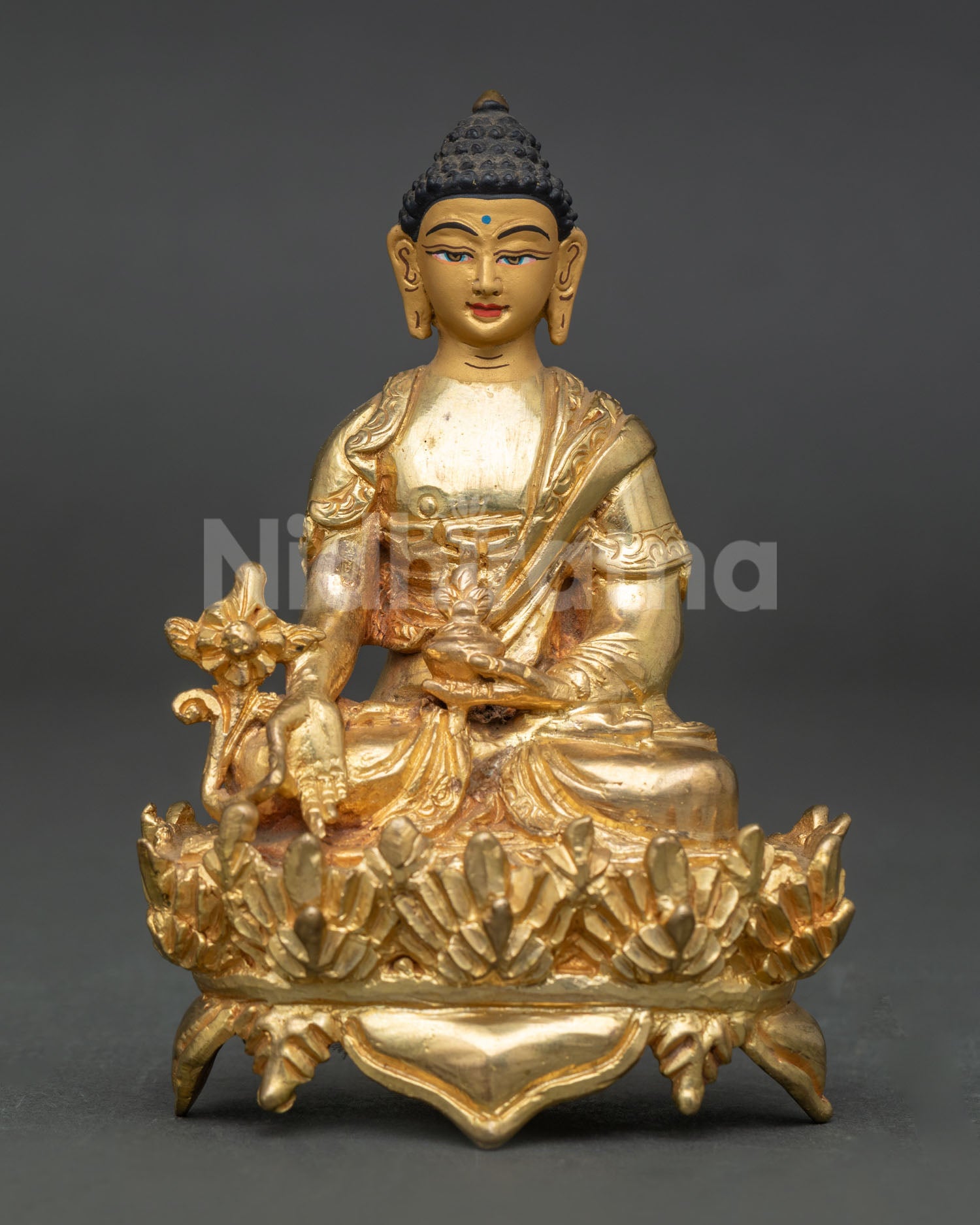 Medicine Buddha sculpture holding myrobalan plant and nectar bowl handcrafted in patan nepal.