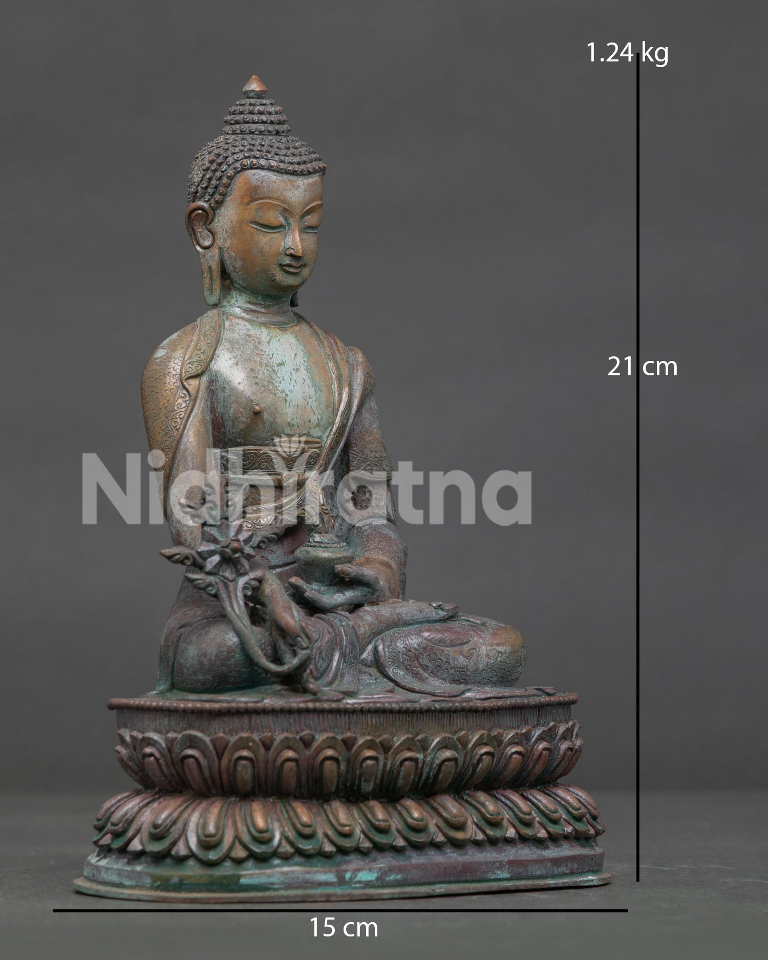 Medicine Buddha seated on double lotus pedestal with monk robe.