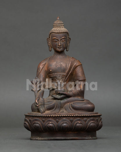 Medicine Buddha seated on lotus pedestal holding healing nectar bowl and Myrobalan plant.