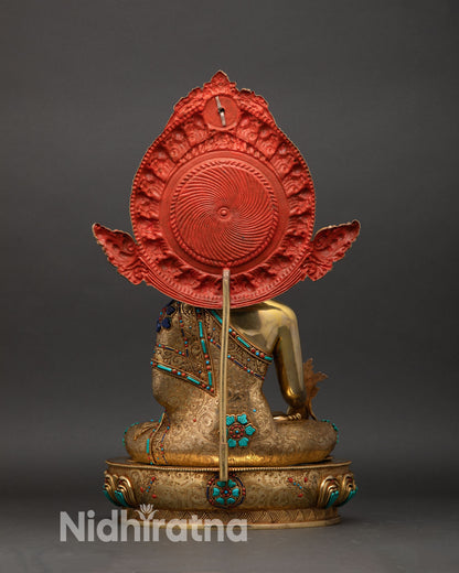 Medicine Buddha statue back view, Himalayan copper Buddhist sculpture with ornate halo and traditional craftsmanship details