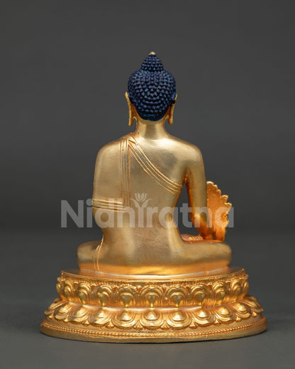 Medicine Buddha statue back view showing detailed copper casting and Newari craftsmanship.