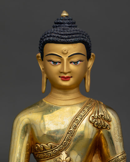 Medicine Buddha statue close up, detailed copper craftsmanship with gold painted sacred features