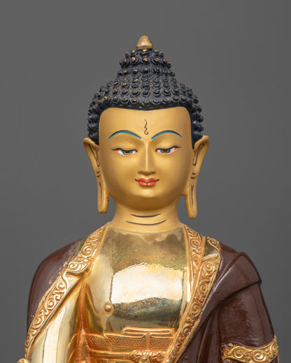Medicine Buddha statue made from copper with a half oxidized and gold fire gilded finish and 24K gold painted face.