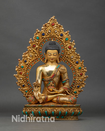 Medicine Buddha statue front view, gold-gilded copper Bhaisajyaguru on lotus throne