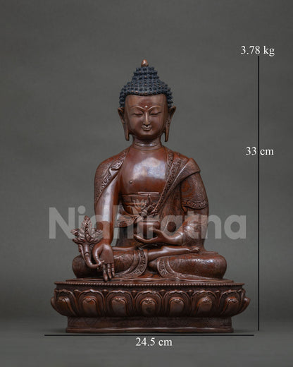 Medicine Buddha statue front view in oxidized copper by Newari artisans.