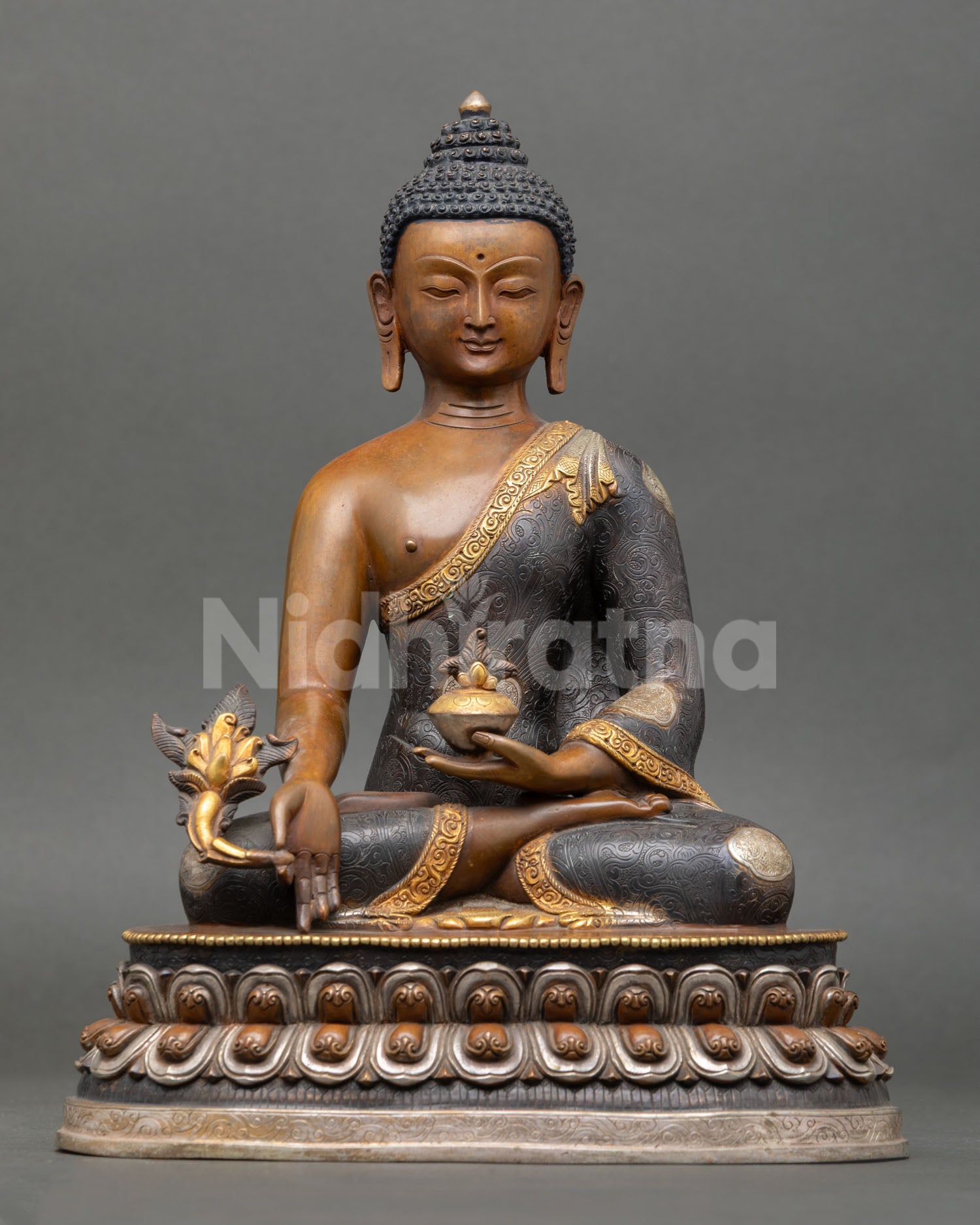 medicine buddha statue front view with oxidized copper and gold-gilded finish